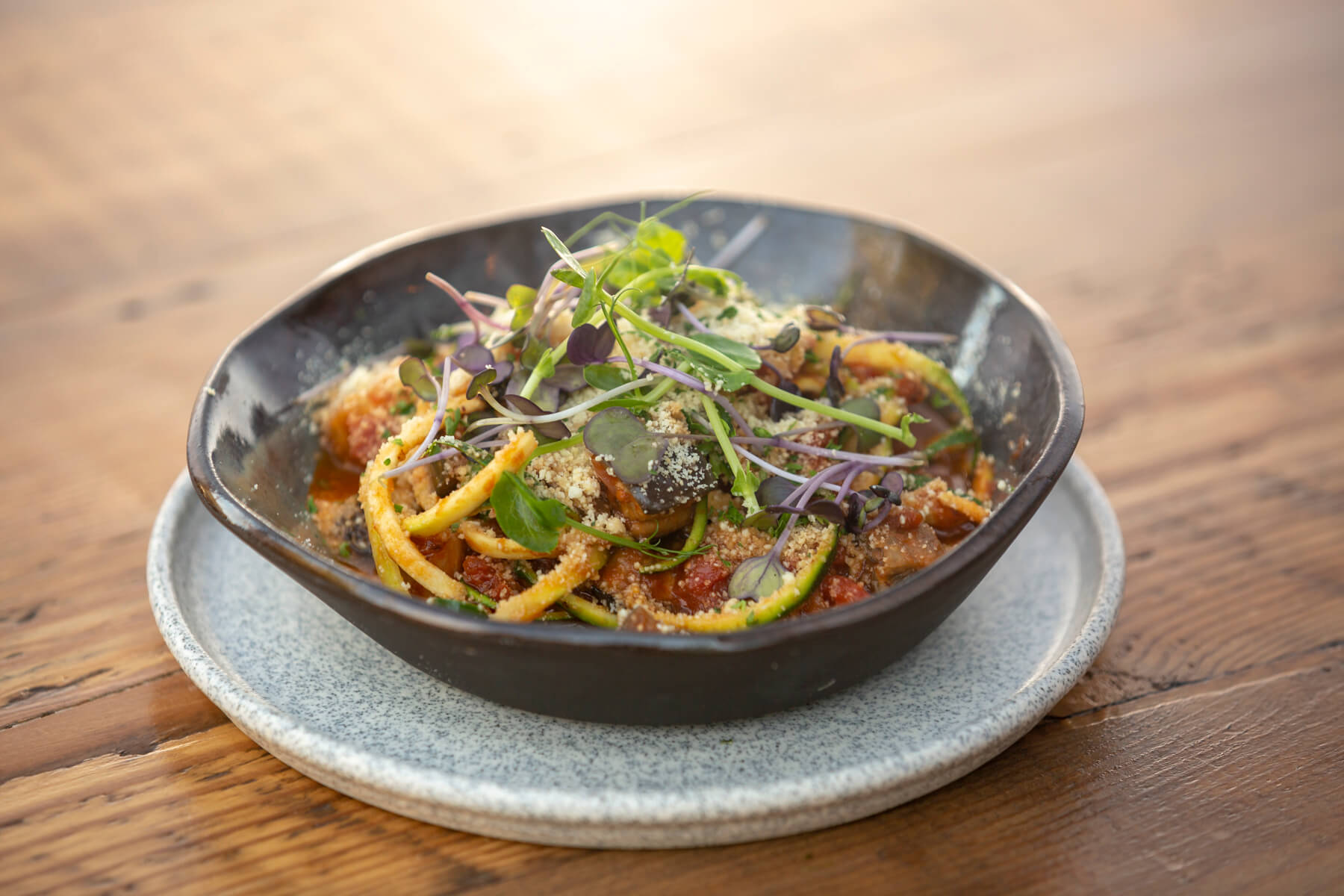 Auckland plant based eatery's organic zucchini spaghetti with eggplant "meatballs" and tomato passata