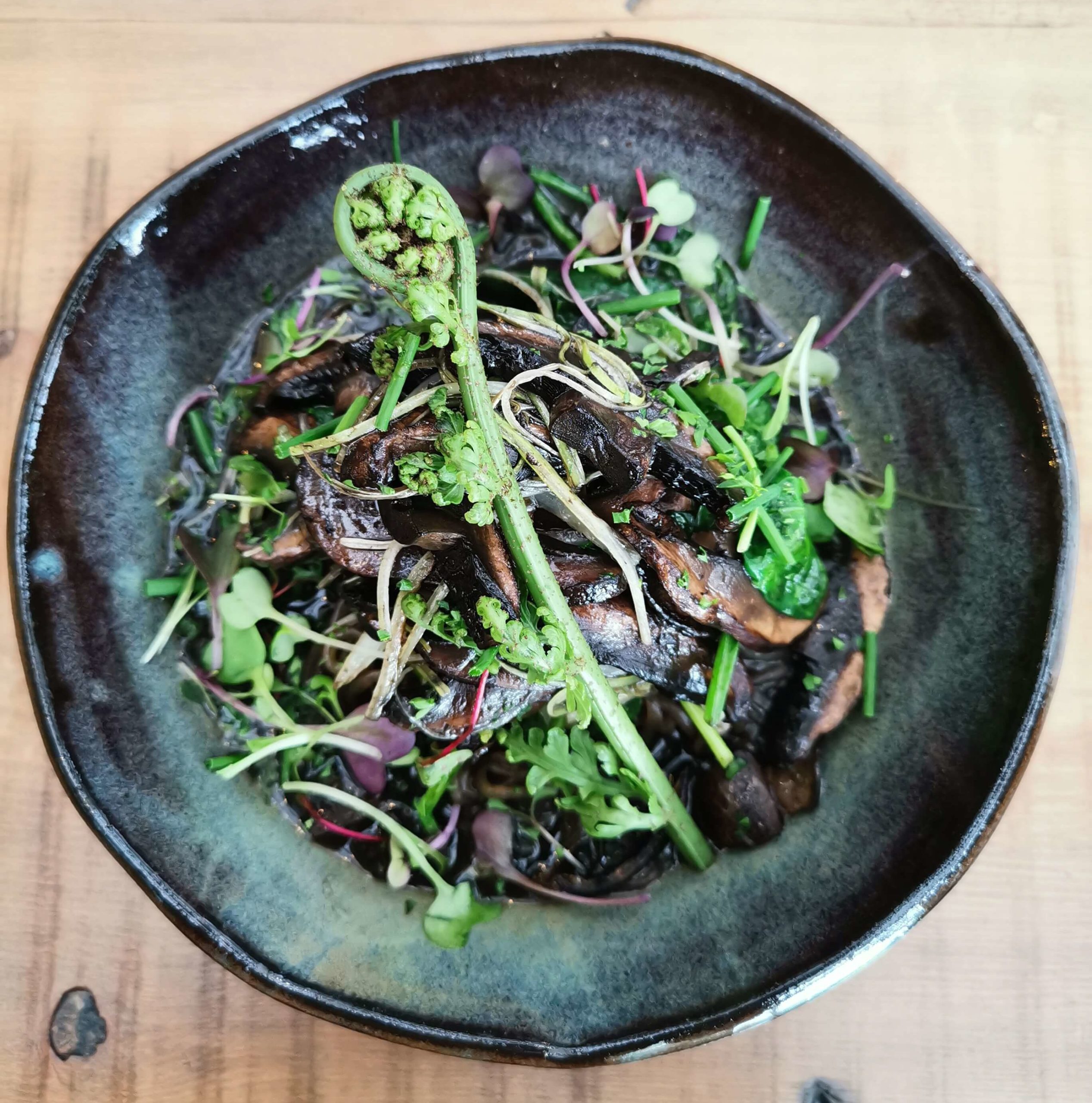 Auckland plant based eatery's mushrooms - three kinds of mushrooms with black garlic and pine nuts