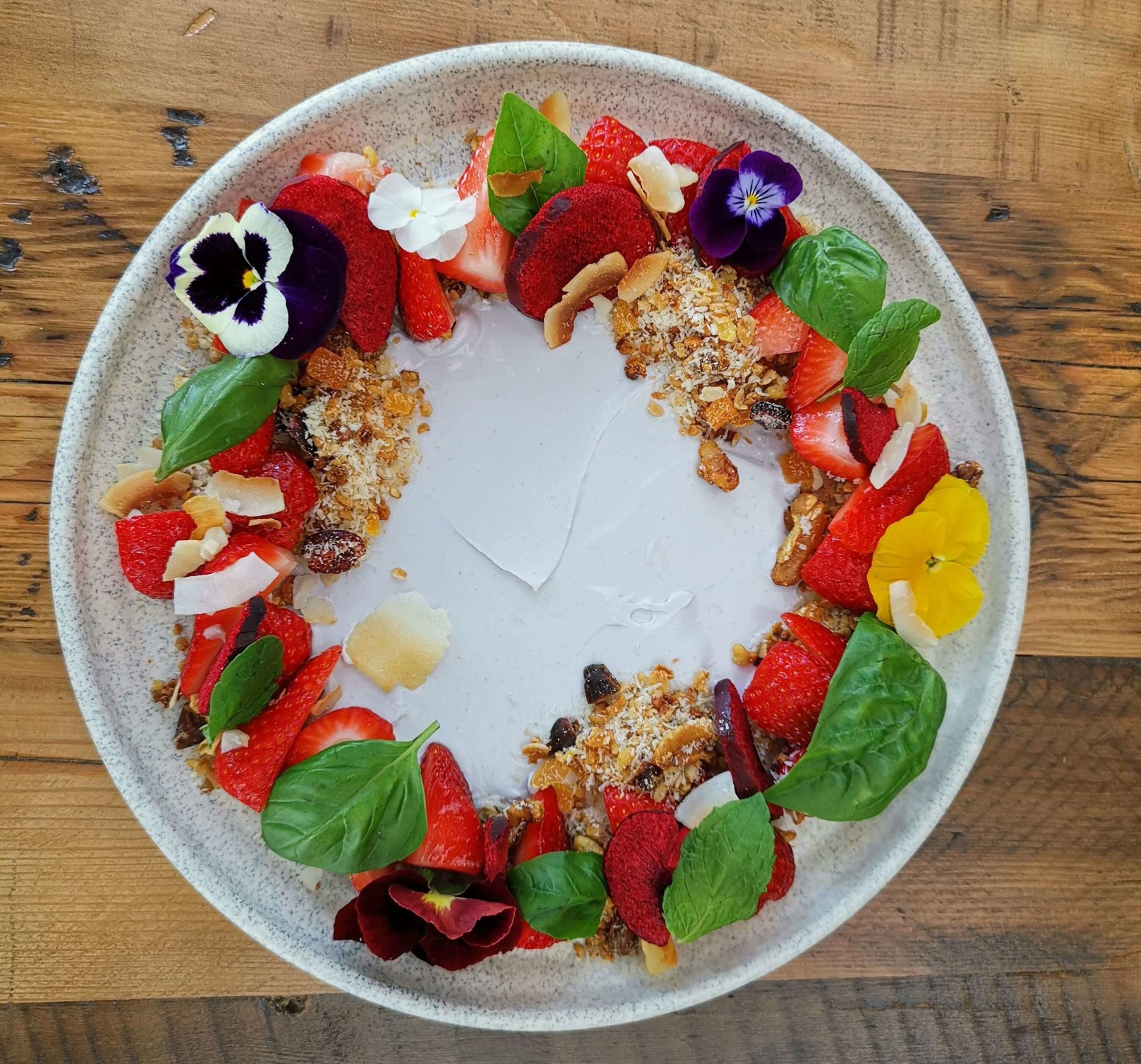 Auckland plant based eatery's Seasonal Fruit - Strawberries with basil, maple and coconut yoghurt
